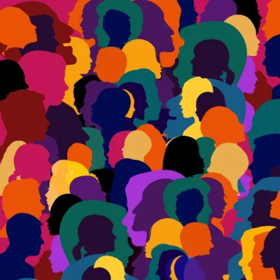 A group of multicolored silhouettes of people slightly overlapping each other, representing diversity